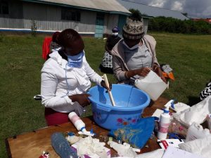 women making soap and sanitizer